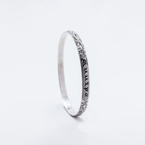 Kuuipo Bangle in Black Enamel and Plumeria
