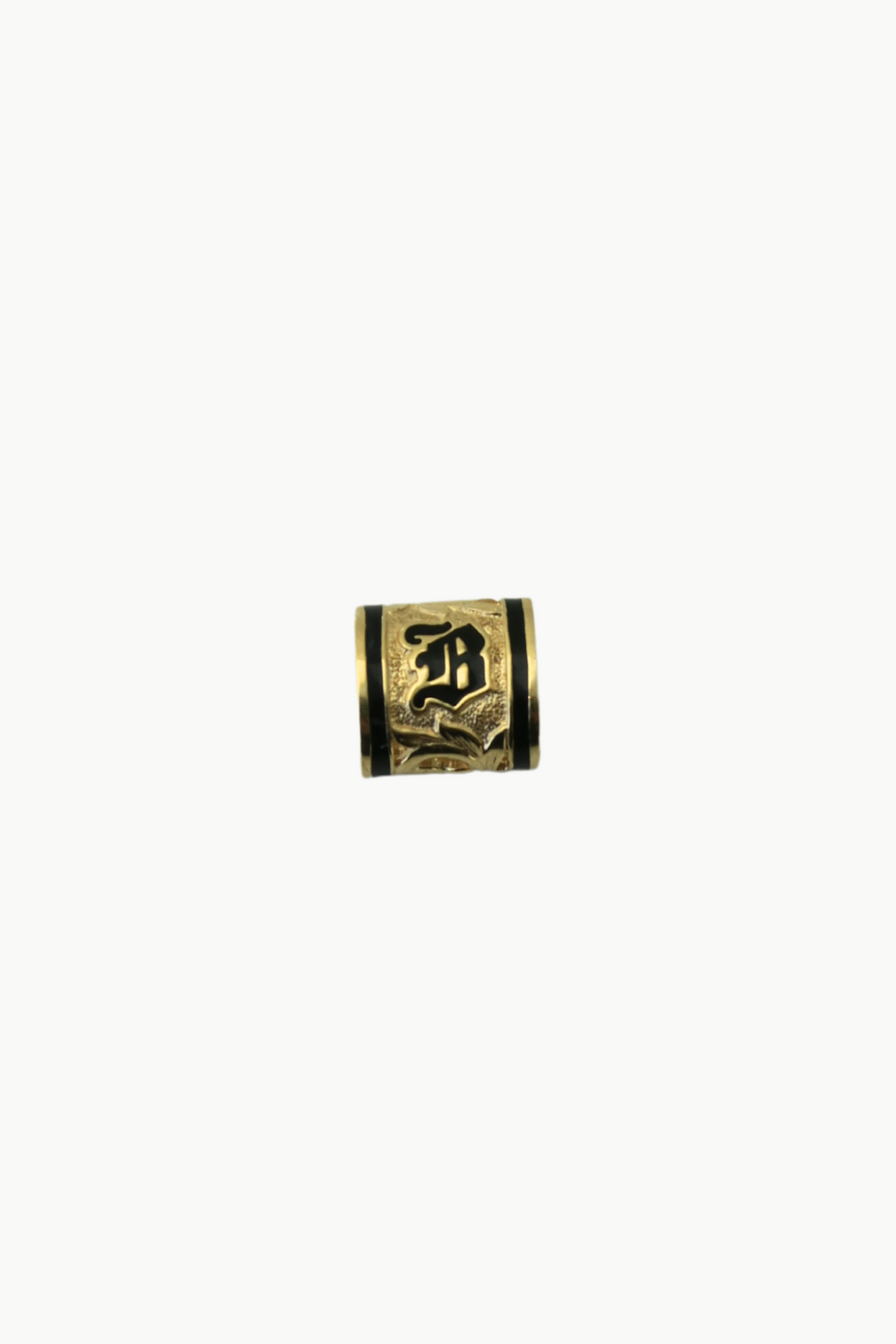 A square-shaped 14k yellow gold pendant with a hand engraved hibiscus design