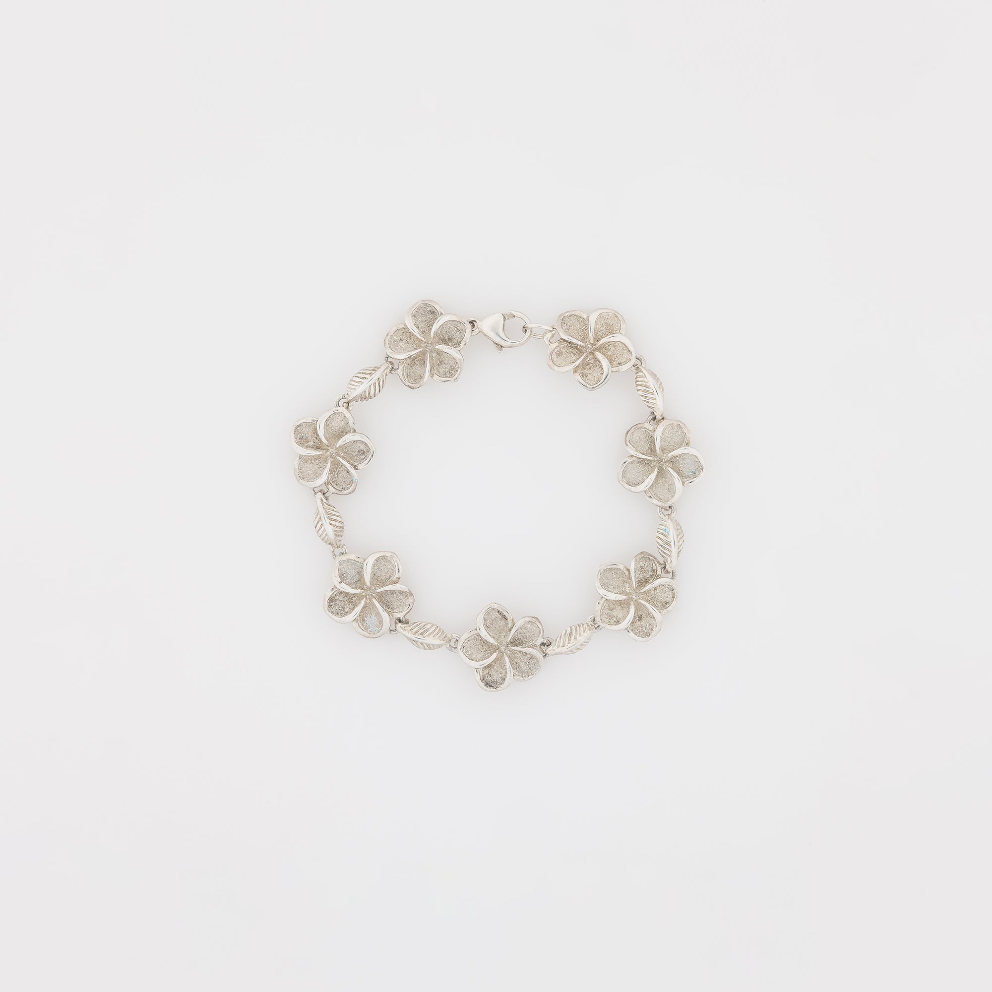 Seven Plumeria with Maile Leaves Bracelet