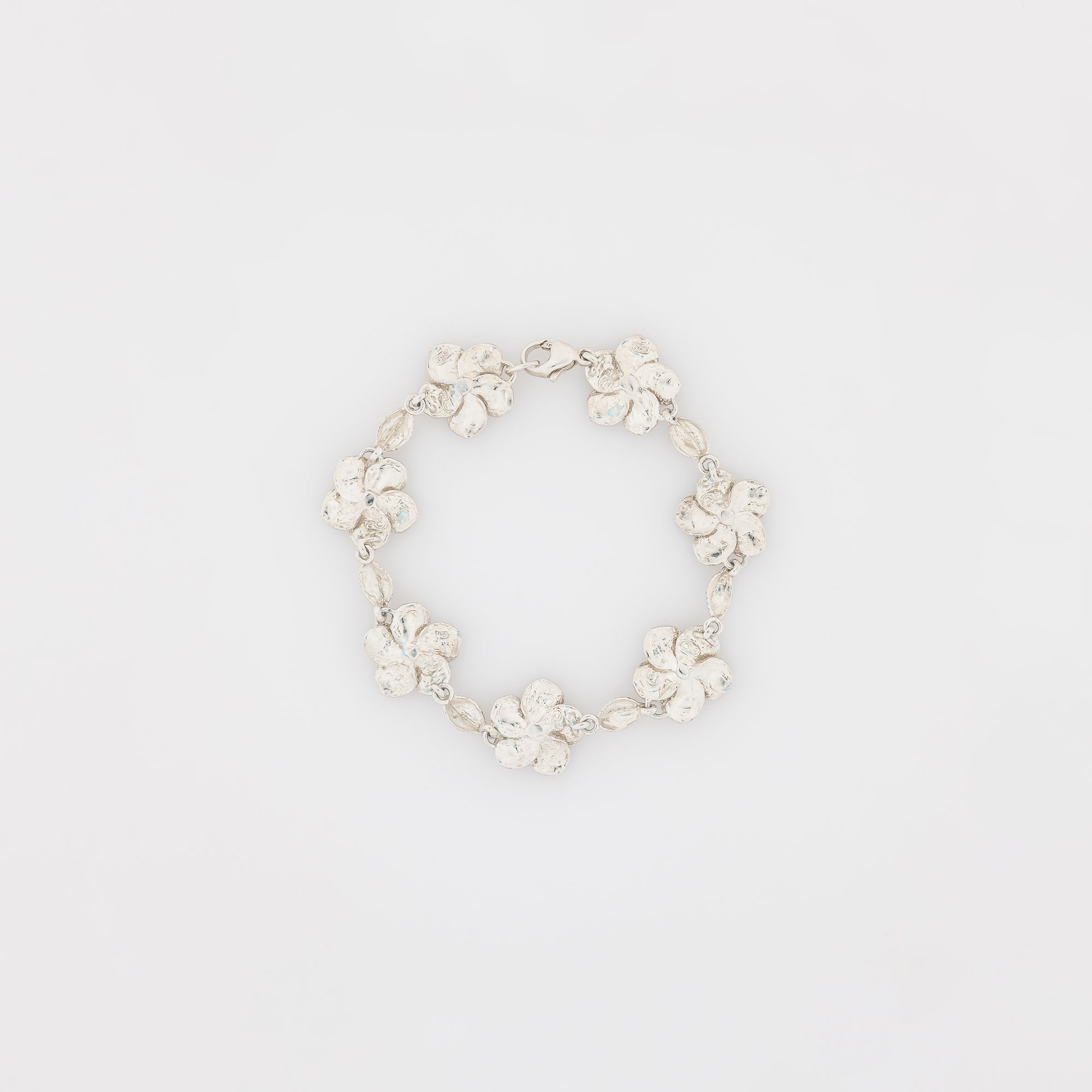 Seven Plumeria with Maile Leaves Bracelet