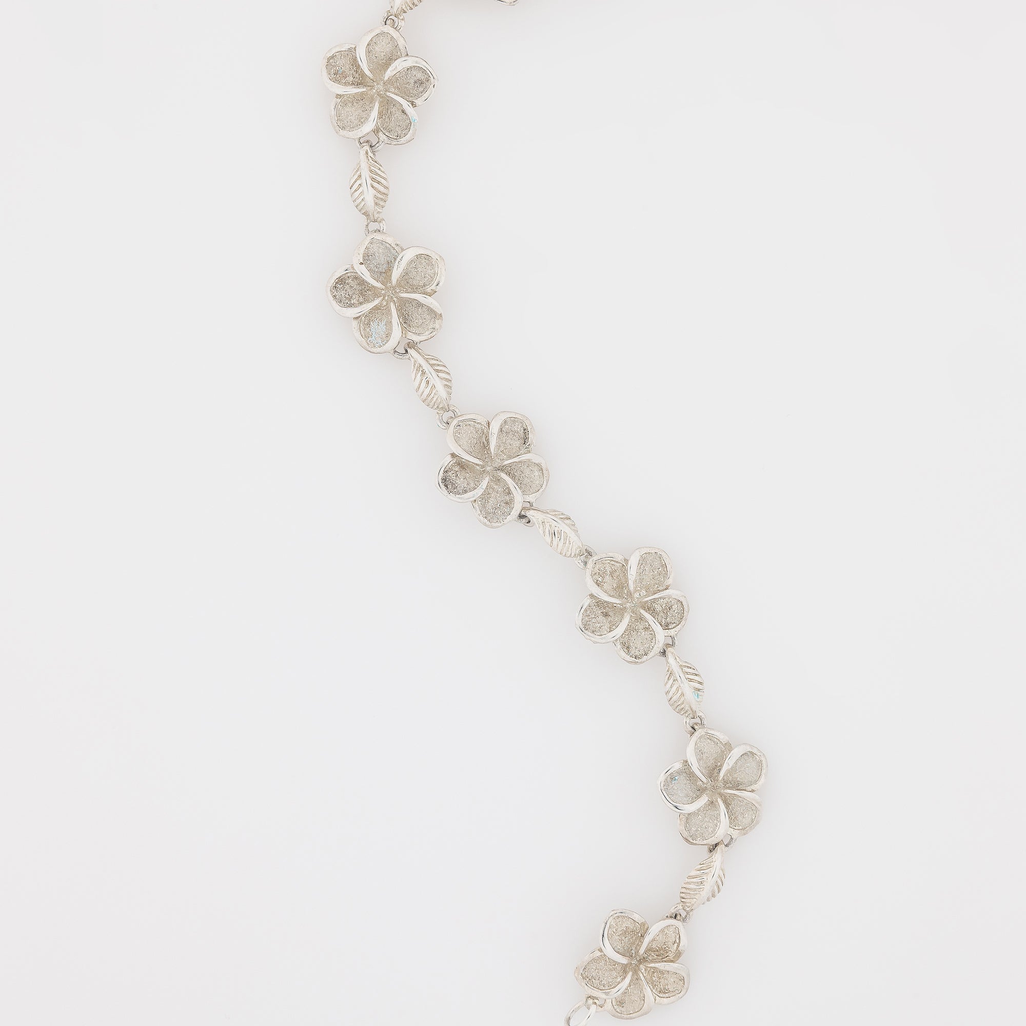 Seven Plumeria with Maile Leaves Bracelet