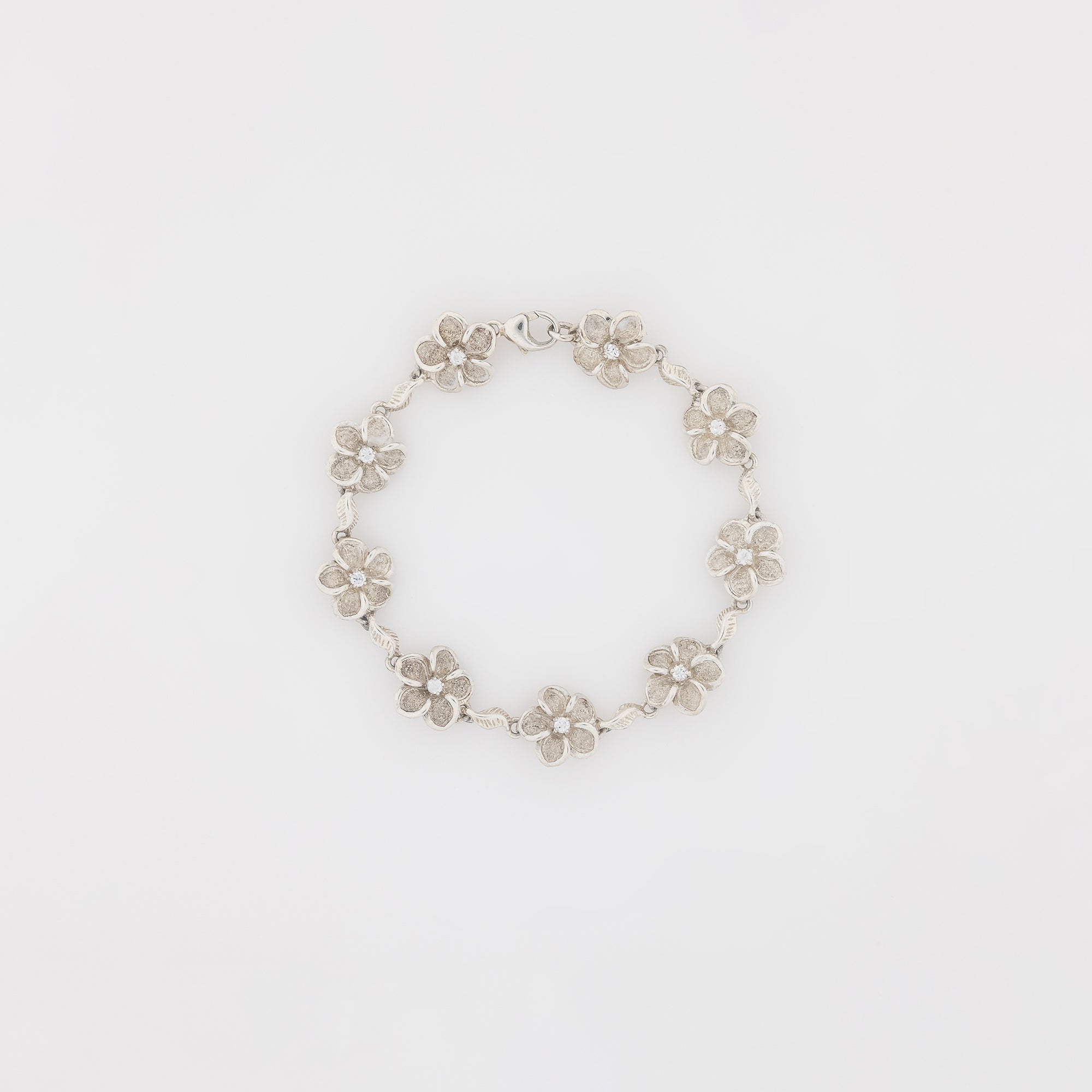 Eight CZ Plumeria with Maile Leaves Bracelet