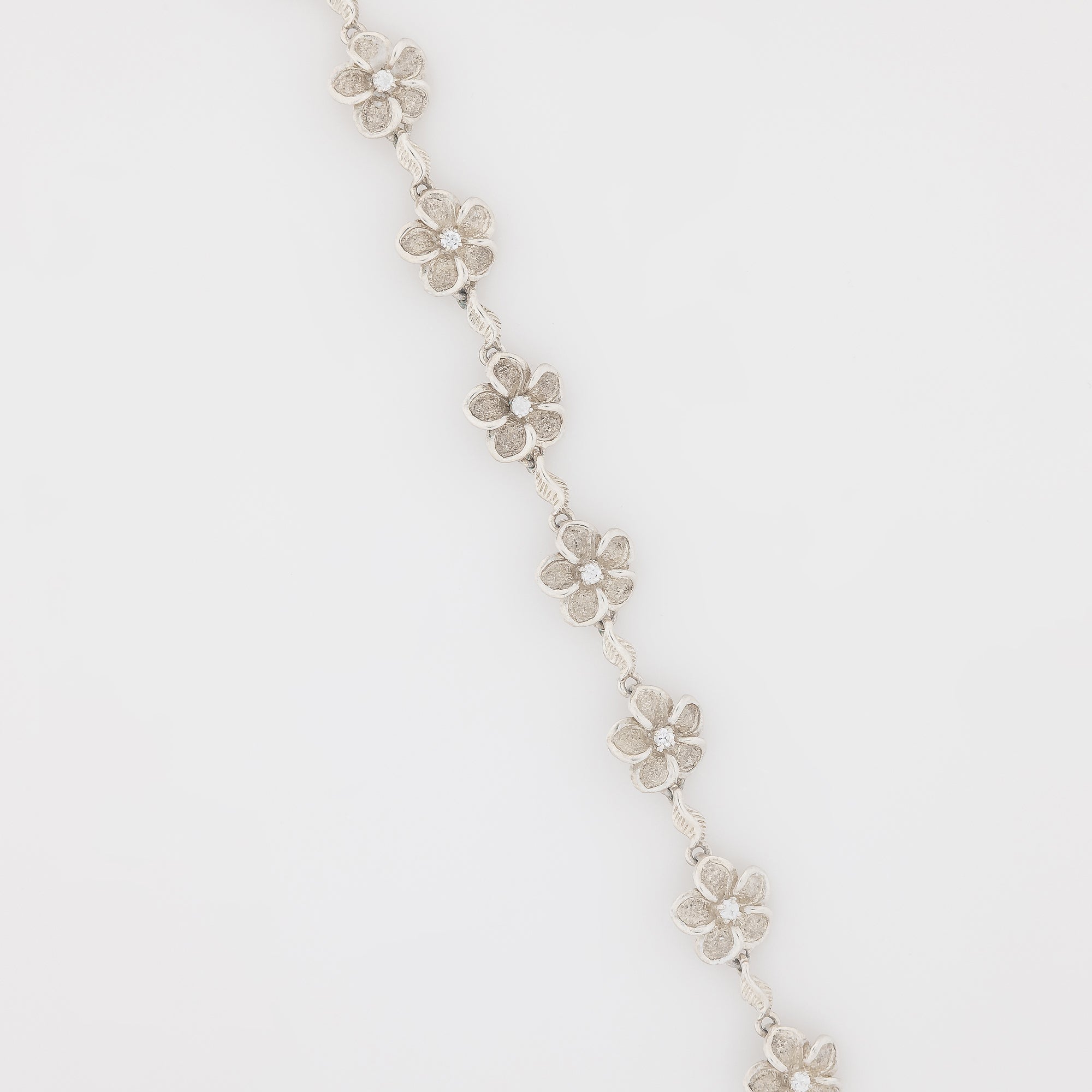 Eight CZ Plumeria with Maile Leaves Bracelet