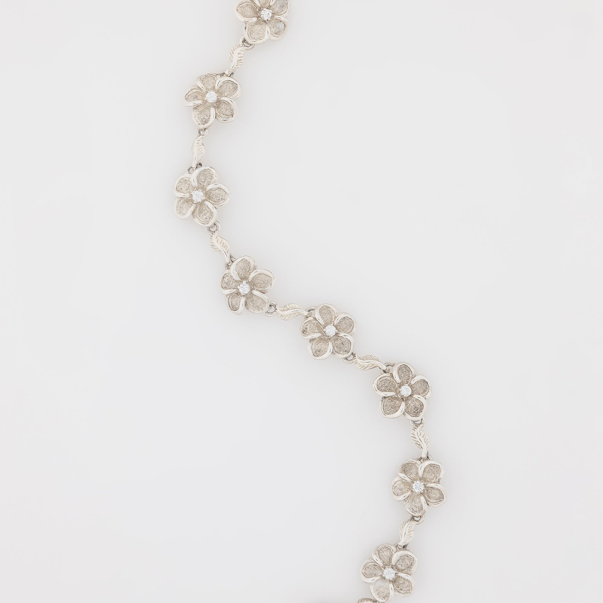 Eight CZ Plumeria with Maile Leaves Bracelet