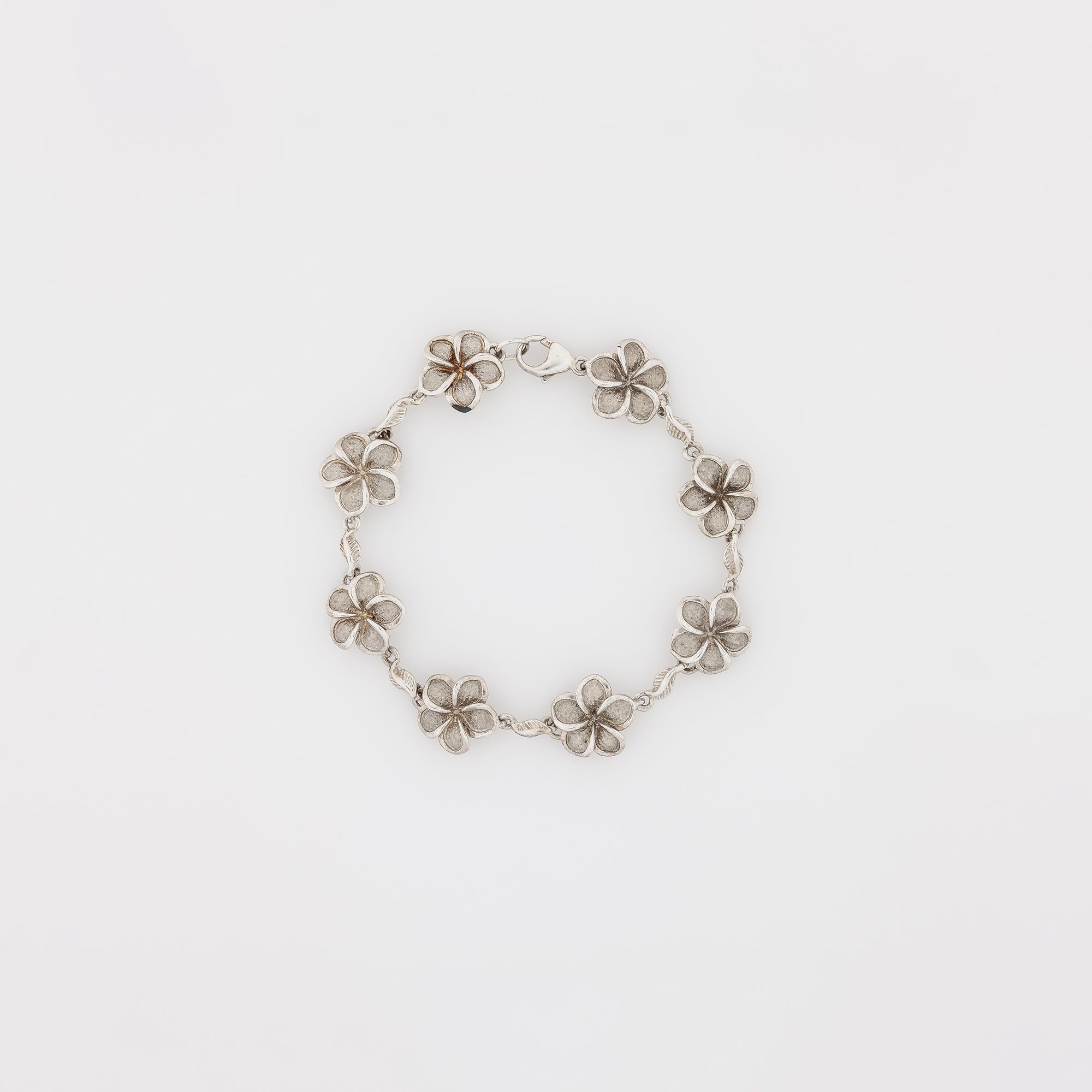 Eight Plumeria with Maile Leaves Bracelet