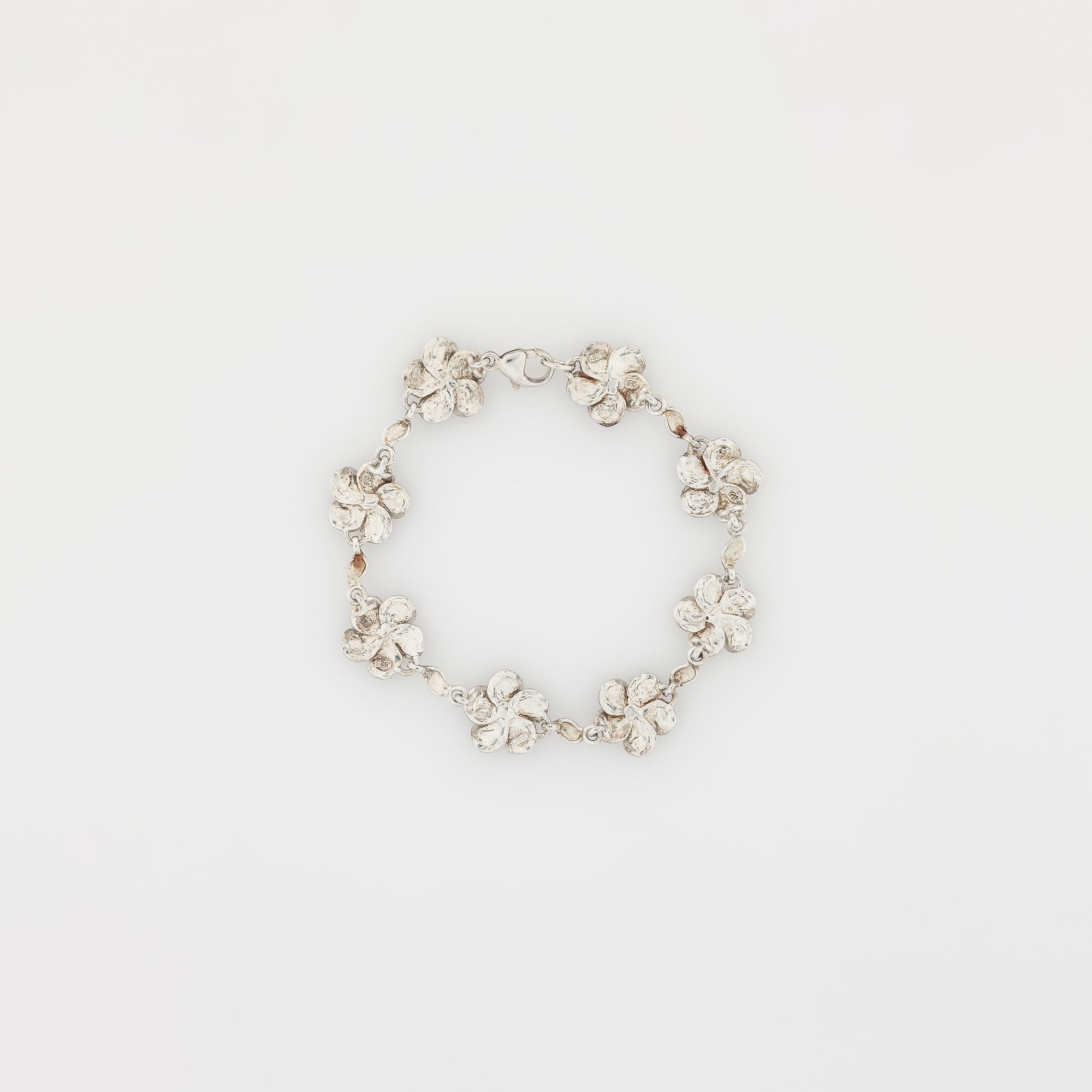 Eight Plumeria with Maile Leaves Bracelet