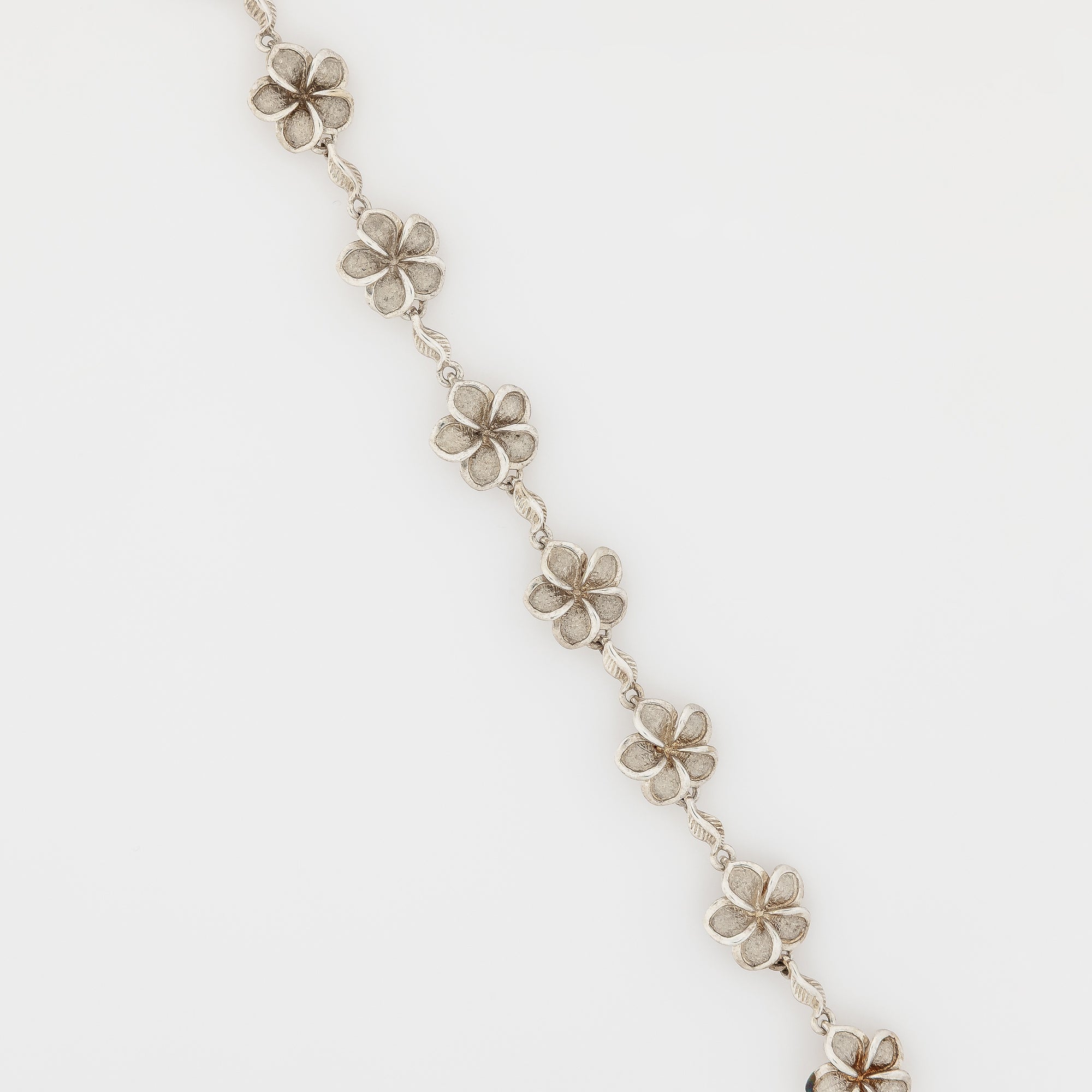 Eight Plumeria with Maile Leaves Bracelet