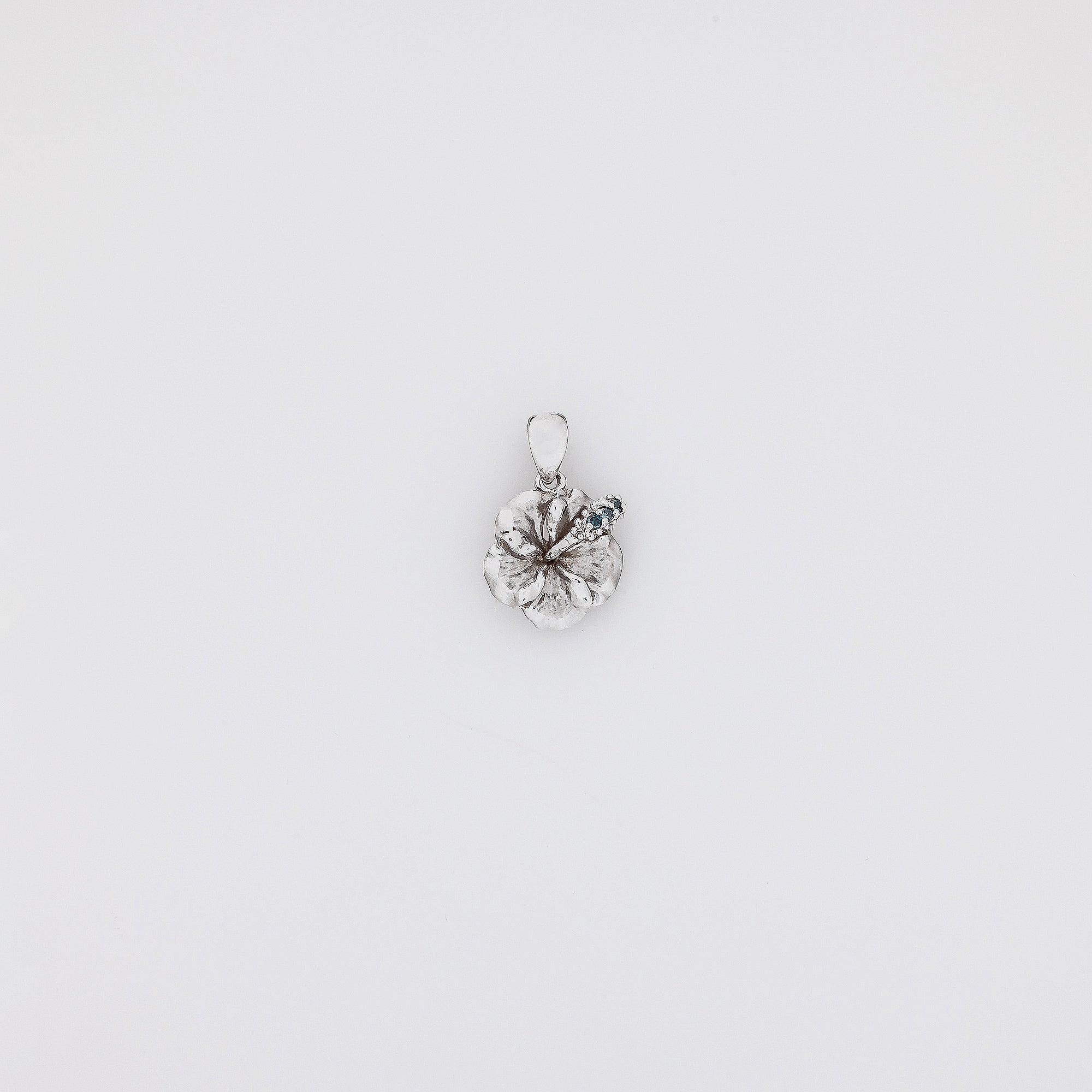 Blue Diamond Hibiscus Pendant in White Gold
